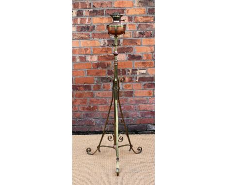 An Arts and Crafts type copper and brass adjustable oil standard lamp, with moulded opaque glass shade, on scroll base, 160cm