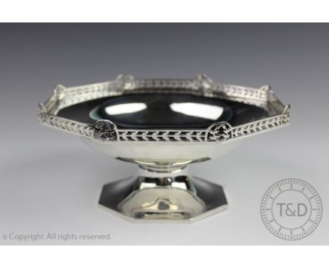 A silver pedestal comport, Walker and Hall, Sheffield  1918, of octagonal form with pierced gallery rim, centrally initialled
