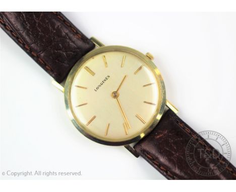 A Gentlemans 14K Longines wristwatch, the circular silvered dial with batons, inside back case stamped 'Longines Wittnauer 14