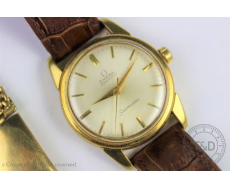 A gentlemans 18ct gold Omega Automatic Seamaster wristwatch, the champagne dial with batons, gilt hands and centre sweep seco