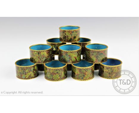 A near set of ten Japanese cloisonne enamel napkin rings, decorated with flowers, with a silver napkin ring (13)