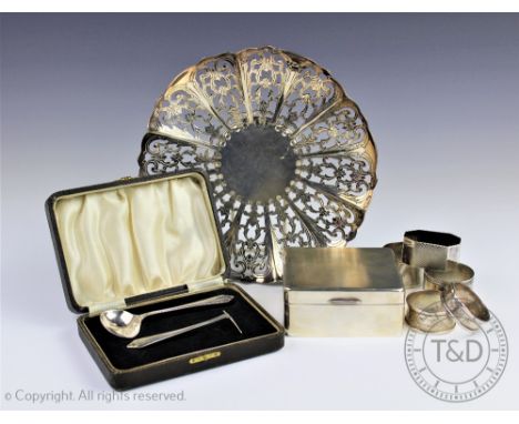 A collection of silver and plated wares, to include; a silver cigarette box with engine turned cover, four silver napkin ring
