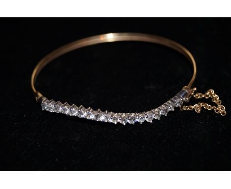 9ct gold bangle set with white stones 