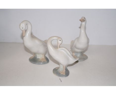 Lladro swan together with two Nao examples 