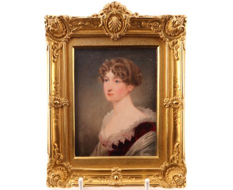 λ John Cox Dillman Engleheart (1782/4-1862)Portrait miniature of a young lady, head and shoulders in a red velvet dress and w