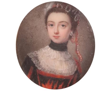 λ British School late 18th Century Portrait miniature of a lady, bust length, wearing pearls in her hairOval in a dark case36