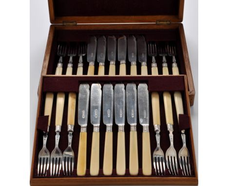 Twelve Edwardian silver and ivory fish knives, with matching fish forks, by Harrison and Howson (George Howson) 1904-1906, in