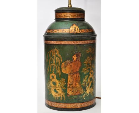 A 19th Century Toleware tea canister converted table lamp, the lamp mount with two light fittings, the canister decorated in 