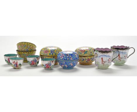 Pair of Chinese Canton enamel cups, with chickens beside flower sprays and rockwork, arcaded rims and loop handles, height 6c