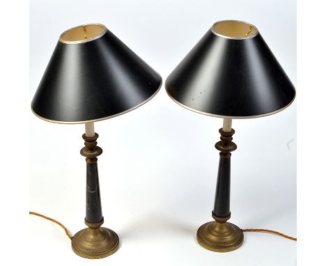 A pair of Regency style 20th Century table lamps, the candle type light fittings on beaded brass urn sconce, black marble col