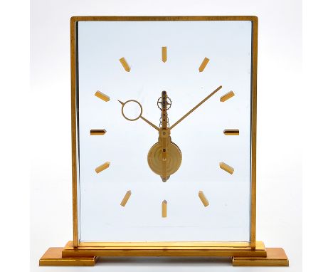Jaeger LeCoultre: a gilt brass and perspex cased mantel timepiece, with visible movement, rectangular, on bracket feet, stamp