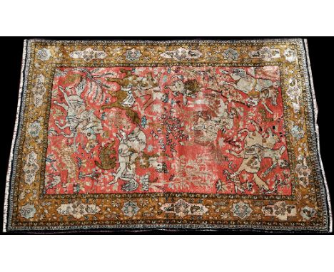 A Persian silk Qum rug, decorated with hunting scenes to field on red ground surrounded by foliate border, 61 1/2 x 43in. (15