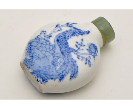 Chinese enamel painted snuff bottle, with phoenix amongst flowers and rockwork, jade stopper, height 5.9cms.  (2)