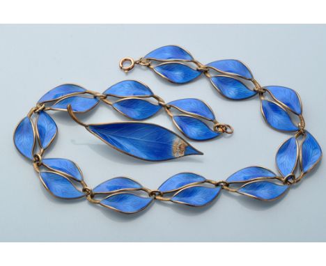 A silver and blue enamel necklace, brooch and ear clip set, by David Andersen, Norway, each link of the necklace made up of t
