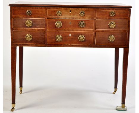 *A George III mahogany wash stand, the rectangular top with moulded edge opening to reveal fitted interior of central hinged 