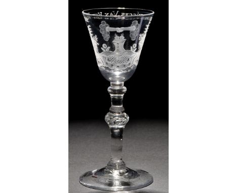 A light baluster friendship goblet of the 'Newcastle' type, the round funnel bowl engraved with pineapples and statuary in an