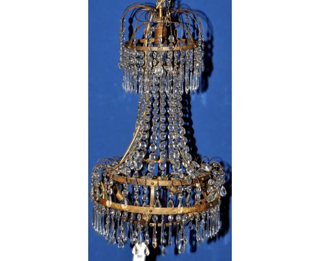 An early 20th Century Swedish style chandelier, decorated with lustre drops and blue glass dome, later converted to electrici