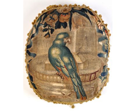 A 17th Century Flemish tapestry fragment cushion, decorated with a parrot to the front, velvet backing and tassel edge, 24 x 