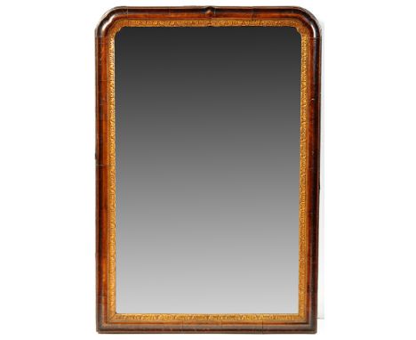 An 18th Century walnut and parcel gilt wall mirror, with later bevelled plate, 20 x 29in. high.