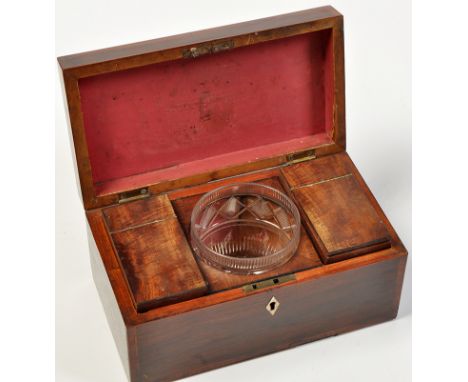 A George III rosewood tea caddy, of rectangular form with crossbanding, brass handle to cover opening to reveal central cut g