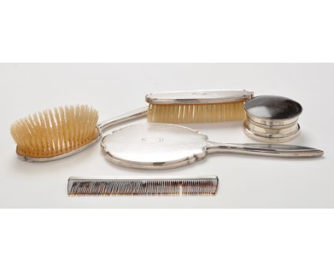 An Elizabeth II four-piece engine turned dressing table set, by Adie Bros., Birmingham 1958-59; and an early 20th Century sil