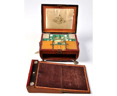 *A 19th Century red leather and brass-bound workbox, the caddy top opening to reveal silk-lined lid interior with transfer de