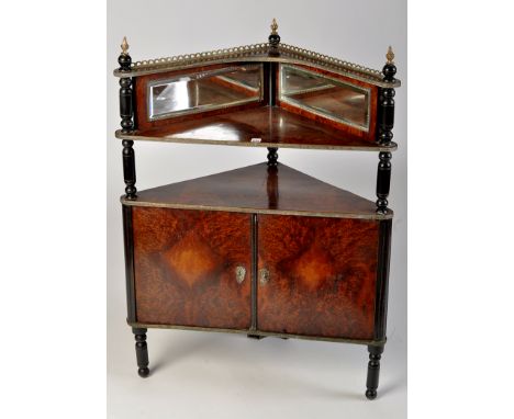 A French early 20th Century thuya wood veneered and ebonised brass mounted corner cabinet, with pierced gallery and brass-mou