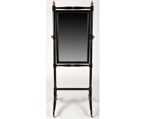 *A 19th Century ebonised cheval mirror, the rectangular plate raised on turned supports with stretchers and gold painted fini