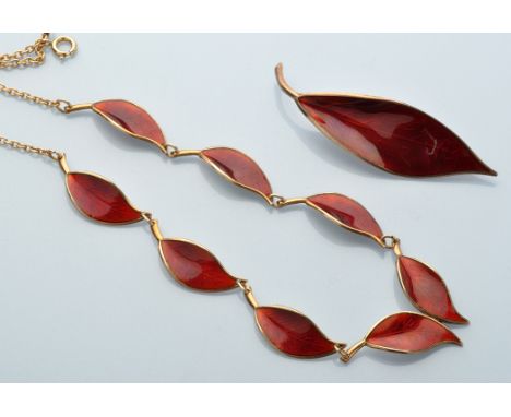 A silver gilt and red enamel leaf pattern necklace, brooch and ear clip set, by David Andersen, Norway, the necklace of singl
