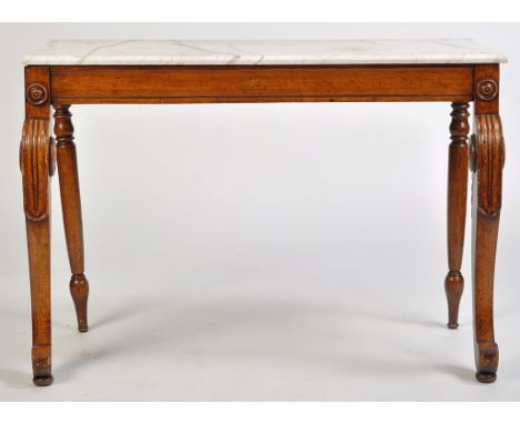 *A Scottish George IV period rectangular console table, the grey marbled top above a plain frieze, decorated with applied rou