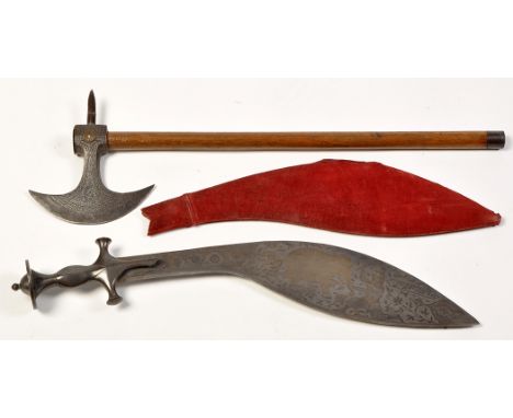 A late 19th Century Persian Talwar kukri, the shaped blade etched and gilt with elephants and figures, leaf design to grip, r