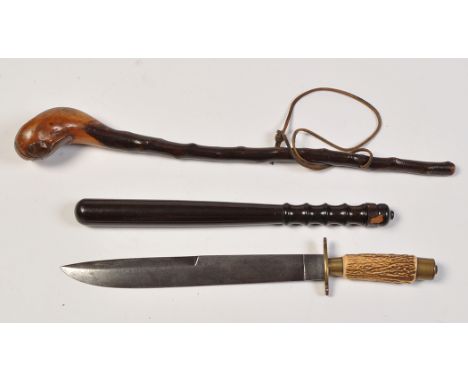 A Continental hunting knife, the single-edged blade above brass cross guard and antler grip, 18 1/2 in. (47cms); together wit