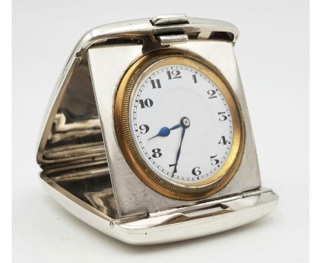 A HEAVY SOLID SILVER ANTIQUE TRAVEL CLOCK, HALLMARKED BIRMINGHAM 1919.108.7gms    6 x 5.5cms 