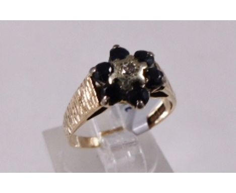 9CT CLUSTER RING. 9ct gold vintage 1979 sapphire and diamond cluster ring, size M