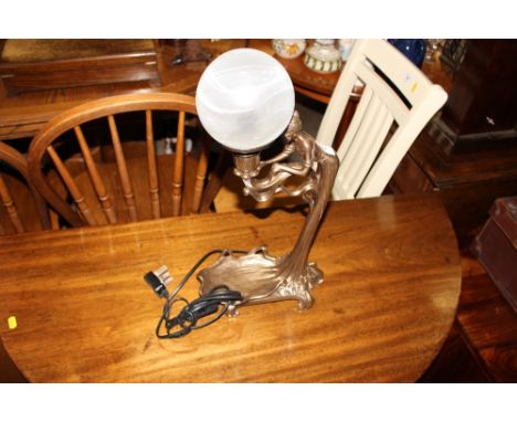 An Art Nouveau style table lamp and shade