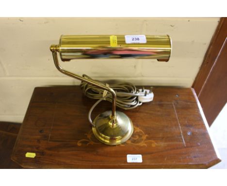 A brass desk lamp