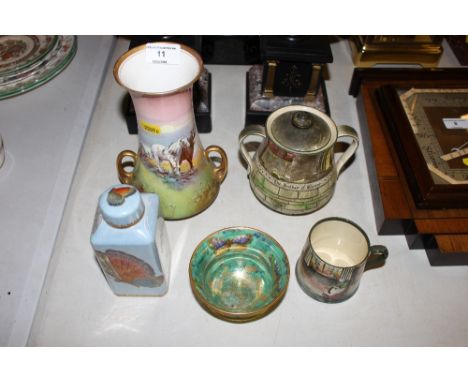 An Aynsley lustre ware butterfly decorated bowl; a Royal Doulton Dickensware mug; a Doulton 'Jack Dawe' series ware bowl and 