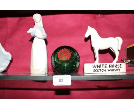 A White Horse scotch whisky advertising model; a Caithness paperweight and a Lladro figurine