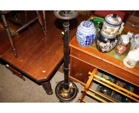 A black lacquer chinoiserie decorated standard lamp