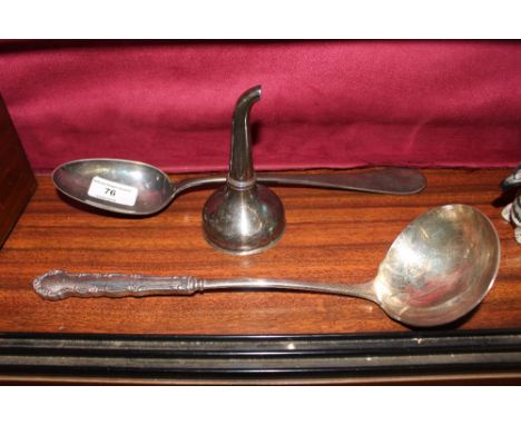 A silver plated wine funnel; a tablespoon and ladle