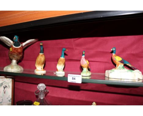 A Beswick model of a pheasant; a smaller similar; a Beswick dish decorated with a pheasant; a Beswick model of a duck and ano