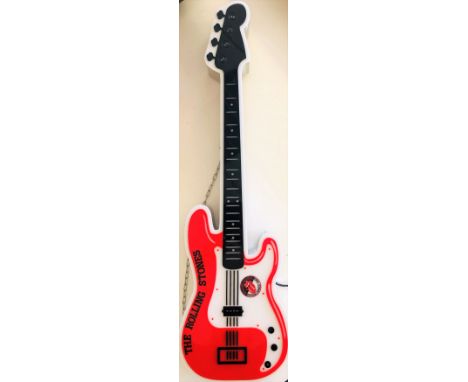 ROLLING STONES LIGHT UP GUITAR. A European issued (likely French) replica guitar (approx 82 cm long) with european plug. Ligh