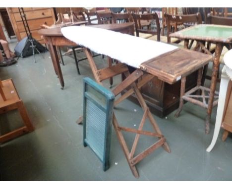 A vintage wooden ironing board, with a vintage wash board