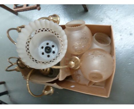 A box of glass lamp shades and a modern metal chandelier