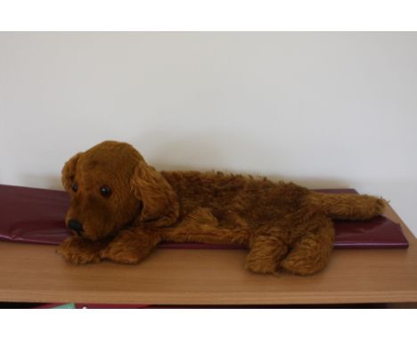 A vintage dog teddy with zip up pouch