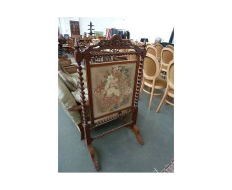 A Victorian rosewood tapestry fire screen, with barley twist supports and stretchers, on four splayed feet and castors, 64cmW