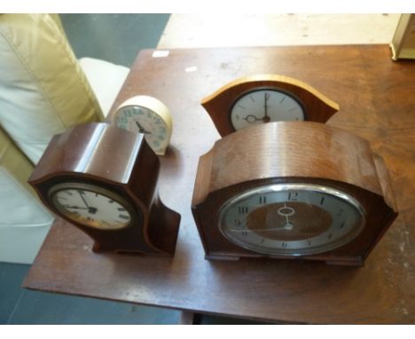 An Art Deco oak cased mantle clock, an Edwardian mahogany and banded mantle clock with key and another Art Deco Eintina mantl