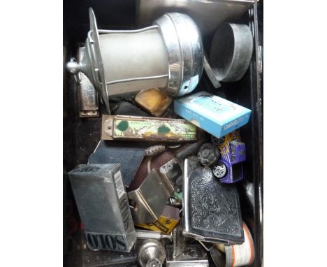 A mixed lot, to include a cigarette case, a manual counter, a lamp, a harmonica, a toy car, all in a metal box with twin side