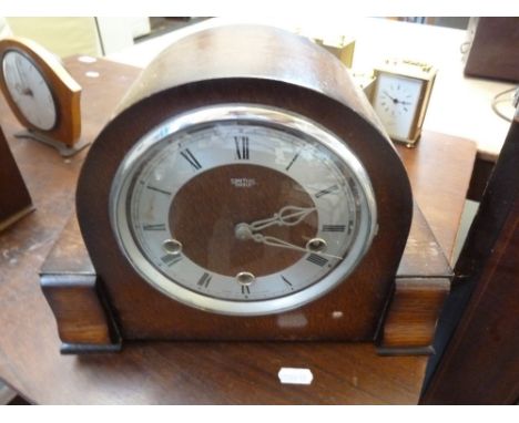 A Smiths of Enfield oak cased mantle clock