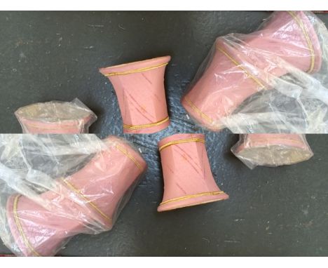 A quantity of pink lamp shades with gold banded decoration (6)